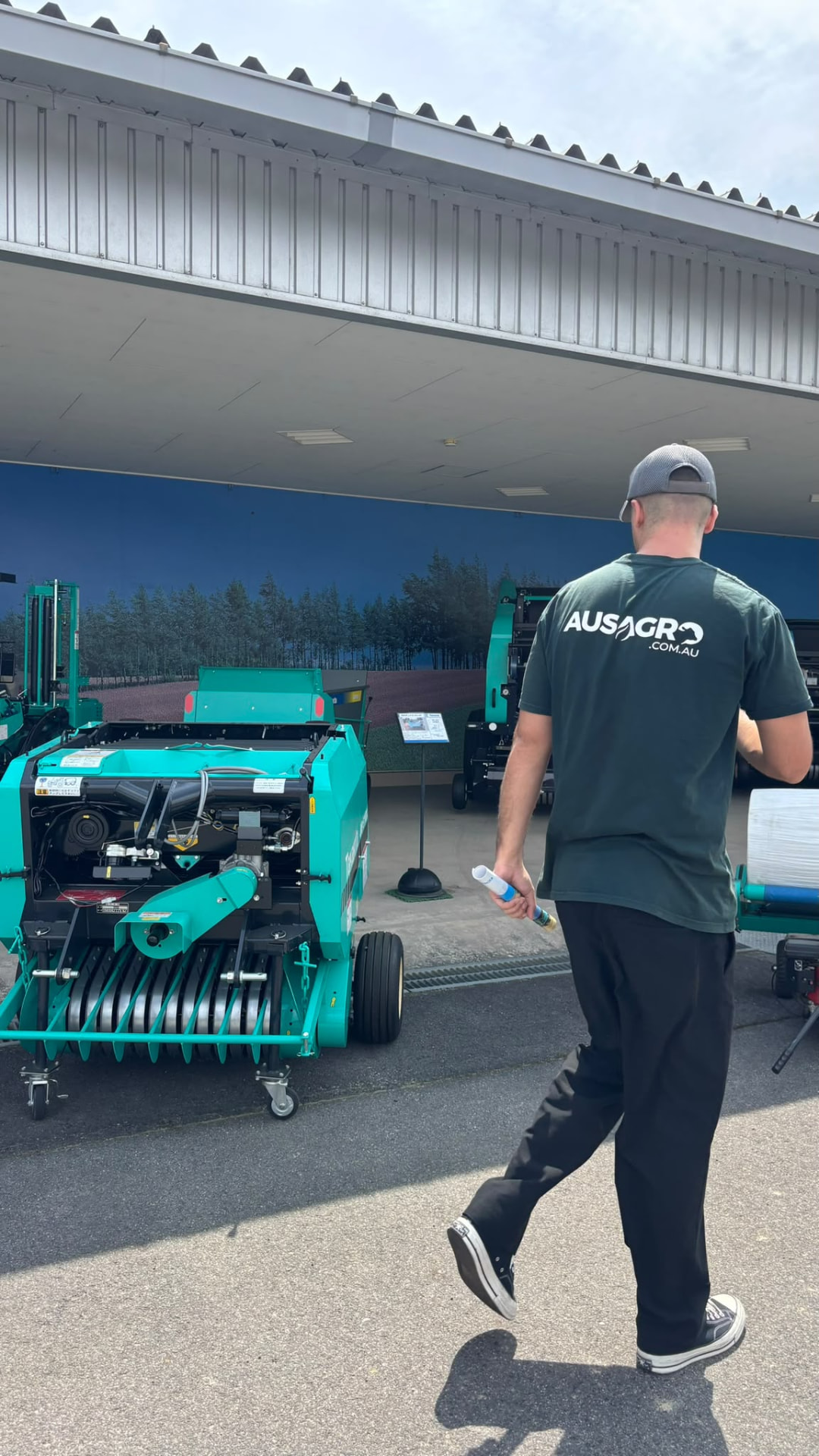 An Aus Agro representative viewing Takakita balers during the factory visit.